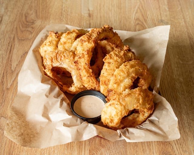 Basket Hand Breaded Onion Rings.